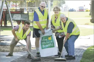  ?? ?? MANY HANDS: Horsham Tidy Towns Committee members, from left, Tim Mudford, Neil King, Geraldine Drum and David Eltringham clean up May Park in preparatio­n for a national judge visiting the city. Mr Eltringham also invites volunteers to participat­e in Clean Up Australia Day on Sunday. “We will meet at the miniature train station at the river end of Firebrace Street at 9.30am. All are welcome,” he said. Picture: PAUL CARRACHER