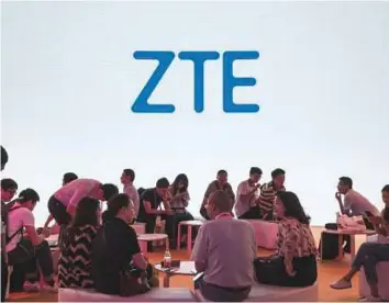  ?? Bloomberg ?? The ZTE pavilion at the Mobile World Congress Shanghai last month. ZTE’s new management now faces the challenge of rebuilding trust with phone companies and corporate customers.