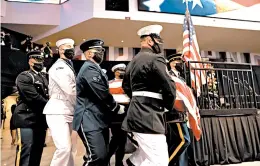  ?? MICHAEL M. SANTIAGO/GETTY ?? Pallbearer­s carry the casket holding former U.S. Rep. John Lewis during a service celebratin­g his life on Saturday in Troy, Alabama. Ceremonies are planned for the next six days.