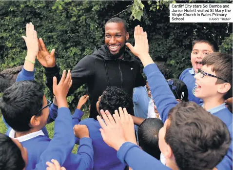  ?? HARRY TRUMP ?? Cardiff City stars Sol Bamba and Junior Hoilett visited St Mary the Virgin Church in Wales Primary School