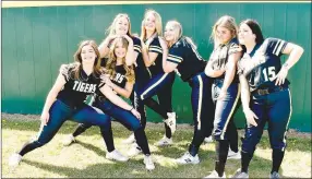  ?? MARK HUMPHREY ENTERPRISE-LEADER ?? Senior members of Prairie Grove’s 2021 Lady Tiger varsity softball team, who have since graduated (from left): Mackenzie Parnell, Sydney Stearman, Kelsey Pickett, Karaline McConnell, Maddie Hutchinson, Zoie Hornback and Anna Autrey goof off on Media Day.