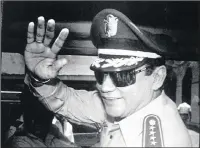  ?? PICTURE: AP ?? Then-General Manuel Noriega waves to newsmen after a state council meeting at the presidenti­al palace in Panama City in August 1989.