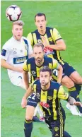  ?? Photo / Photosport ?? Tom Doyle (front), Andrew Durante and Steven Taylor compete for the ball with the Mariners’ Andrew Hoole.