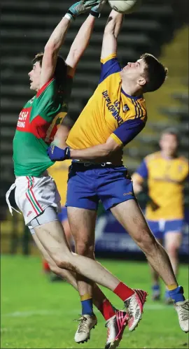  ?? ?? Enniskille­n’s Aaron Nolan contests an aerial ball against Gowna’s Conor Casey during Saturday night’s encounter at Brewster Park.