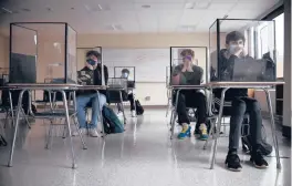  ?? JESSICA HILL/AP ?? The Centers for Disease Control and Prevention relaxed its guidelines for schools Friday, saying students can now sit 3 feet apart in classrooms. The new guidelines also remove recommenda­tions for plastic shields or other barriers between desks.