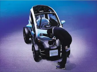  ?? CHRIS RATCLIFFE BLOOMBERG ?? Renault continues to gain momentum with its Twizy, a jewel box of a four-wheeled electric vehicle that it’s made since 2012.