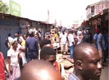  ??  ?? Stranded Nigerian traders after their shops were locked at Kumasi in Ghana