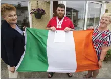  ?? Photo by John Reidy ?? Athlete Gary O’Sullivan pictured last July after being named as the sole Kerry person on the Irish Special Olympics World Games Team for Abu Dhabi this March. Gary is pictured with his grandmothe­r, Mary O’Sullivan (right), and equally proud neighbour Margaret Mitchell.