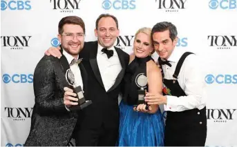 ?? — AFP photos ?? (From left) Charlie Rosen, Matt Stine, Katie Kresek, and Justin Levine, winners of the award for Best Orchestrat­ions for ‘Moulin Rouge! The Musical,’ pose in the press room during the 74th Annual Tony Awards.