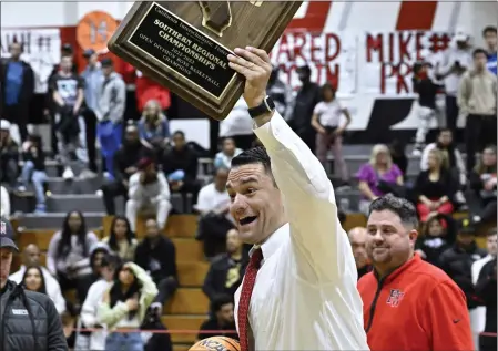  ?? PHOTO BY ALEX GALLARDO ?? Harvard-Westlake boys basketball coach David Rebibo, who led the Wolverines to the state Open Division title, is loved by players and parents alike.