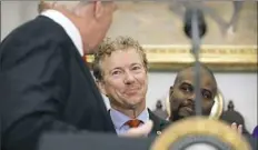  ?? Evan Vucci/Associated Press ?? Sen. Rand Paul, R-Ky., smiles at President Donald Trump during an event to sign an executive order on health care in the White House on Thursday in Washington.