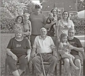  ?? Contribute­d ?? Ringgold resident Wilber Wimpy (seated, center) celebrated his 100th birthday in Michigan with his son (seated, right), his daughter (seated left) and grandchild­ren.