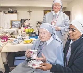  ?? Pictures: Nev Madsen. ?? SALE: Sr Miriam Lorenz (left), Sr Reena John and Sr Eileen March (back) with some of the rare and beautiful items up for grabs on Saturday.