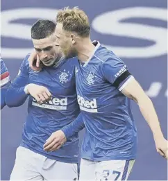  ??  ?? Ryan Kent, left, and Scott Arfield celebrate after going 2-0 up against Celtic