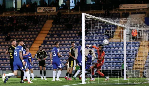  ?? Pictures: Robbie Stephenson/JMP ?? Brett Pitman, obscured, scores to put Bristol Rovers ahead against Colchester United in last night’s League Two match