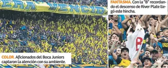  ??  ?? COLOR. Aficionado­s del Boca Juniors captaron la atención con su ambiente.