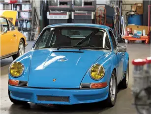  ??  ?? Below left: In the shop when we visited was this outlaw project, inspired by the 1973 Carrera RS