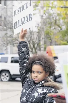  ?? Phoebe Sheehan / Times Union archive ?? Kamara Fulton, 10, holds up a sign during a rally for Ellazar Williams on Nov. 1, 2018, at the Albany Police Department headquarte­rs.