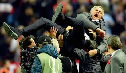  ?? — AP ?? Manchester United manager Jose Mourinho is thrown into the air by his coaching staff after United’s Europa League final win against Ajax Amsterdam on Wednesday night.