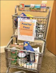  ?? COURTESY LEOMINSTER PUBLIC LIBRARY ?? Leominster Public Library patrons have the option to donate nonperisha­ble food items rather than pay late fees now through the end of the year.