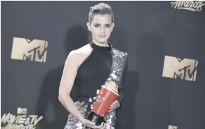  ?? CHRIS PIZZELLO/INVISION/THE ASSOCIATED PRESS ?? Emma Watson took home the first gender-neutral award for best actor in a movie for Beauty and the Beast, during Sunday’s 2017 MTV Movie and TV Awards.