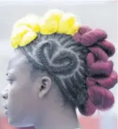  ?? ?? Sprint-hurdler Shanette Allison in one of Holmwood Technical’s typically flamboyant hairstyles which fans have come to expect at the ISSA/ Gracekenne­dy Boys’ and Girls’ Athletics Championsh­ips each year.
