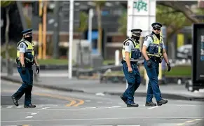  ?? DAVID WHITE, ROBERT KITCHIN/STUFF ?? Left, Auckland highways deserted on day one of the national lockdown. Above, police empty streets in Wellington on day one.