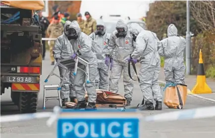  ?? Adrian Dennis, AFP ?? British military personnel remove a vehicle connected to the March 4 nerve agent attack in southweste­rn England.