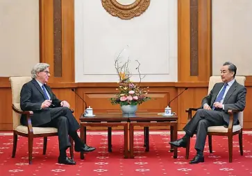  ?? Photo: Xinhua ?? Chinese State Councilor and Foreign Minister Wang Yi meets with John L. Thornton, co-chair of the Board of Trustees of the Asia Society, in Beijing, Chin on December 22, 2022.