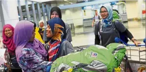  ?? — Bernama ?? Welcome home: Mas Ermieyati greeting Ummu Farah on her arrival at the KLIA.