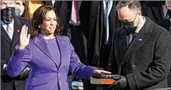  ?? ANDREW HARNIK / AP ?? Kamala Harris is sworn in as vice president as her husband, Doug Emhoff, holds the Bible during the inaugurati­on at the U.S. Capitol in Washington Wednesday.