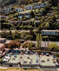  ?? ?? The city-sanctioned homeless encampment on the Marinship Tennis Courts in Sausalito on April 6. Many former anchor-outs lived there.