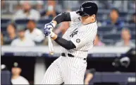  ?? Jim McIsaac / Getty Images ?? The Yankees’ Anthony Rizzo connects on a sacrifice fly against the Twins at Yankee Stadium on Thursday.