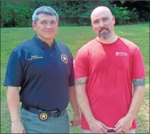  ??  ?? Top: Directing traffic, Floyd County sheriff’s deputy Harrison Dupree makes sure parents know where to go for the Give A Kid A Chance event on Saturday. Bottom: Floyd County Sheriff Dave Roberson (left) and BLESS leader Jason Cribb lead the way Saturday at the Give A Kid A Chance back to school event at the jail.