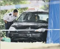  ?? PICTURE: PA WIRE ?? INVESTIGAT­ION: Police examine the car believed to have been involved in the fatal accident.