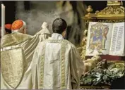  ?? Fabio Frustaci Pool Photo ?? CARDINAL Giovanni Battista Re, left, delivered the pope’s homily during vespers at St. Peter’s Basilica.