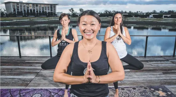  ?? Picture: JERAD WILLIAMS ?? Yoga instructor Judes Yang, pictured with Sarah Breakspear and Ashleigh Green, will open her own yoga studio called State of Sahaja.