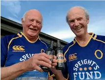  ?? STU PIDDINGTON ?? Former Otago rugby players Ross Parkes, left, and Nevis Jones celebrate the Otago Ranfurly Shield win in 2013.