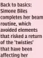  ??  ?? Back to basics: Simone Biles completes her beam routine, which avoided elements that risked a return of the ‘twisties’ that have been affecting her performanc­es