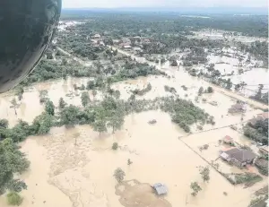  ?? PHOTO: MIME PHOUMSAVAN­H VIA REUTERS ?? Calamity . . . An aerial view shows the flooded area after a dam collapsed in Attapeu province, Laos last month.