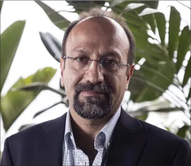  ?? PHOTO BY JOEL C RYAN — INVISION — AP ?? Director Asghar Farhadi poses for portrait photograph­s for the film ‘Everybody Knows’, at the 71st internatio­nal film festival, Cannes, southern France.