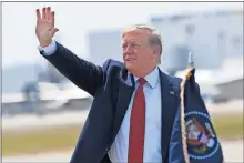  ??  ?? President Donald Trump waves to the crowd Wednesday after arriving on Air Force One at Louisville Internatio­nal Airport in Louisville, Ky. [SUSAN WALSH/ THE ASSOCIATED PRESS]