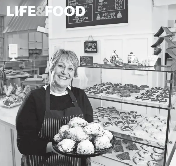  ?? PHOTOS BY BARBARA J. PERENIC/COLUMBUS DISPATCH ?? Sue Bissonnett­e with a batch of chocolate chip scones in her bakery, Sweet Tooth Cottage in Powell.