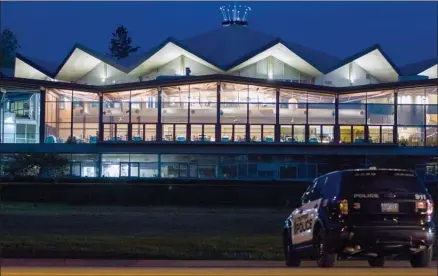  ?? The Canadian Press ?? Stratford Police sit outside the Stratford Festival’s Festival Theatre after a bomb threat caused the cancellati­on of the opening night performanc­e of “The Tempest” in Stratford, Ont., on Monday.