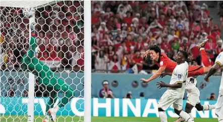  ?? — AP ?? High flyer: south Korea’s Cho Gue-sung heads the ball to score his side’s second goal against Ghana during the Group H match at the education City stadium.