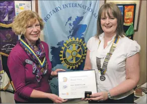  ?? Photograph: Iain Ferguson, The Write Image. ?? Sheana Fraser, left, receives her award from president Paula Ross.