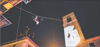  ?? — The Washington Post photo courtesy of Pro Loco Casteldura­nte ?? Children in Italy expect treats from La Befana on the morning of Jan 6. As the legend goes, the three kings asked an old woman to come with them to bring gifts to baby Jesus. She said she was too busy. She changed her mind, but it was too late to catch up. To make up for the bad decision, she flies on her broomstick bringing treats to children each year on Three hings’ aay, or bpiphany.