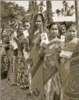  ?? PTI ?? People stand in a queue to cast their votes during assembly elections, Agartala