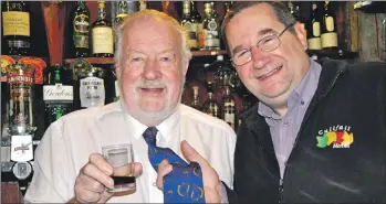  ??  ?? Ivor Campbell wearing his whisky tie and Cuilfail owner Simon Fletcher.