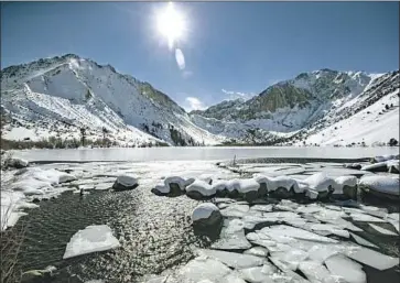  ?? Brian van der Brug Los Angeles Times ?? ICE BREAKS UP at the mouth of Convict Creek in the Sierra Nevada. Snowpack in the Sierra and Cascade ranges could decline 45% by 2050, a study led by the Lawrence Berkeley National Laboratory concluded.